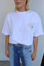 SSAINT oversized t shirt small cream heart in left hand corner worn by model